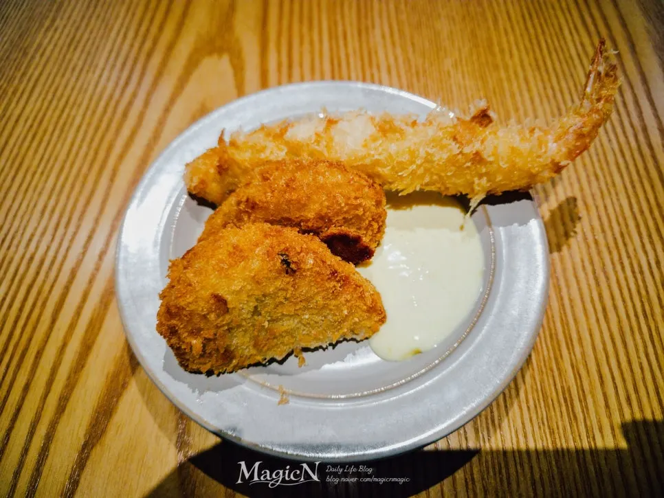 A piece of loin katsu topped with mustard