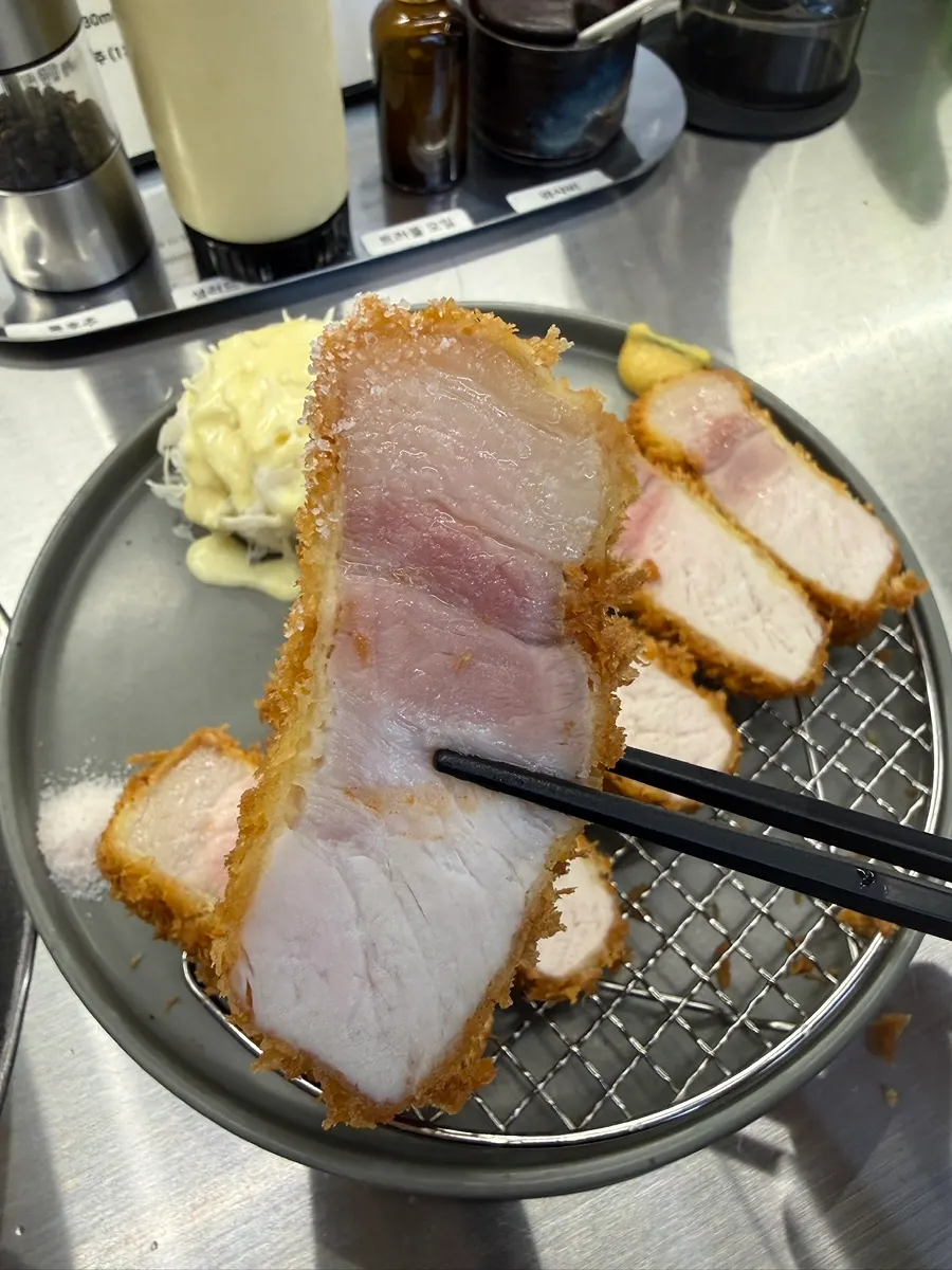 First bite of sang loin katsu dipped in salt
