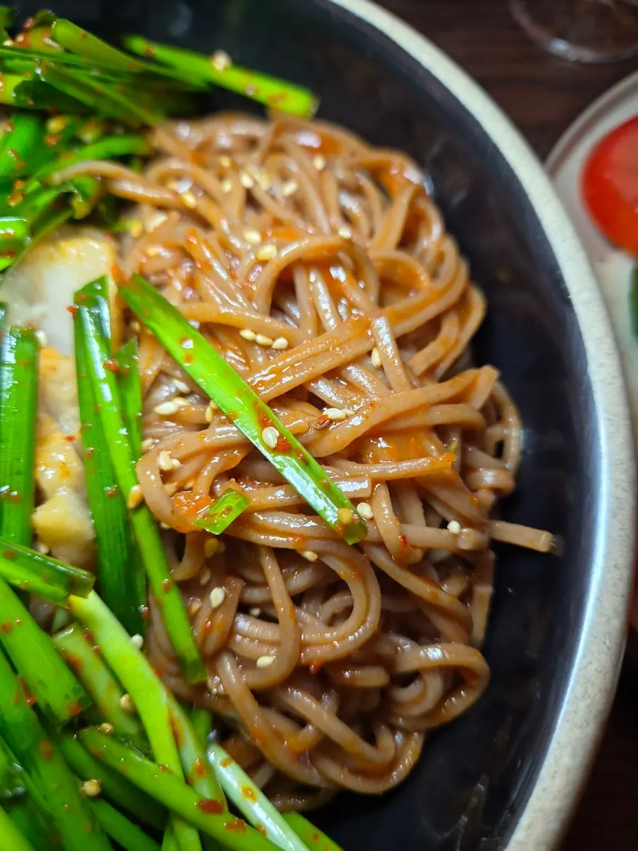 Close-up of chewy makguksu noodles