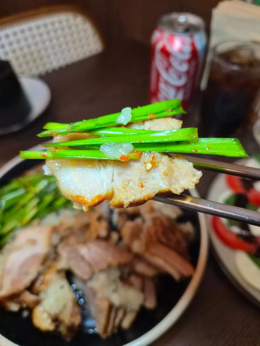 Bossam served with crisp chive salad