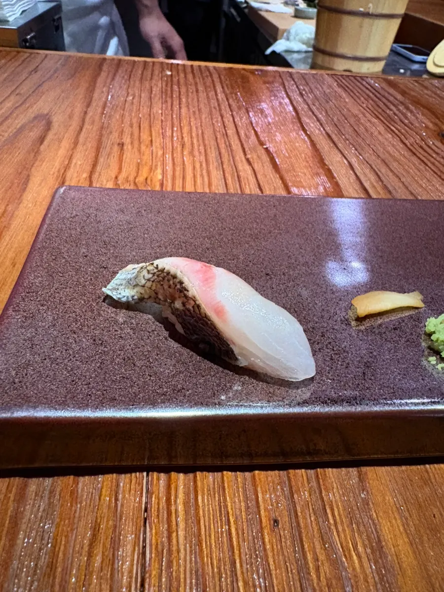 A piece of grilled golden eye snapper gimbap