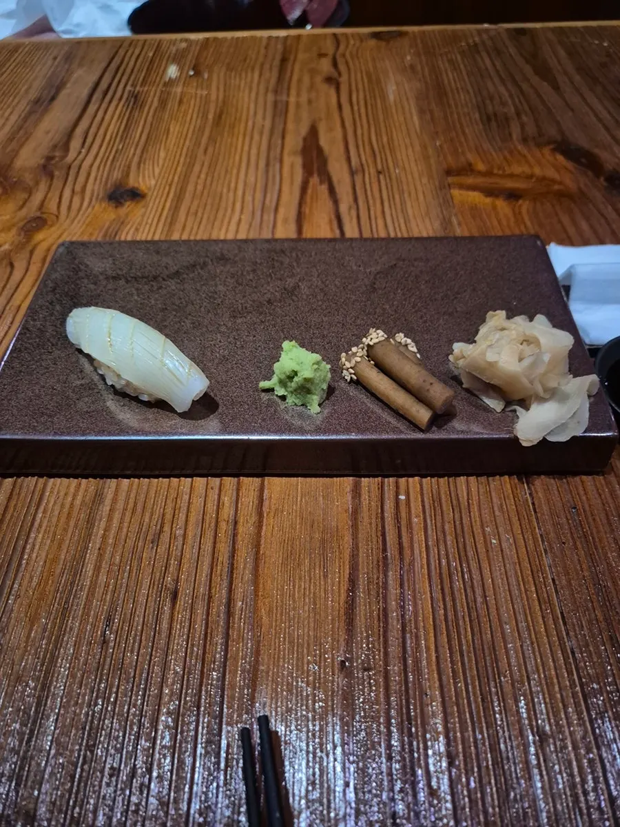 A piece of red seabream sushi