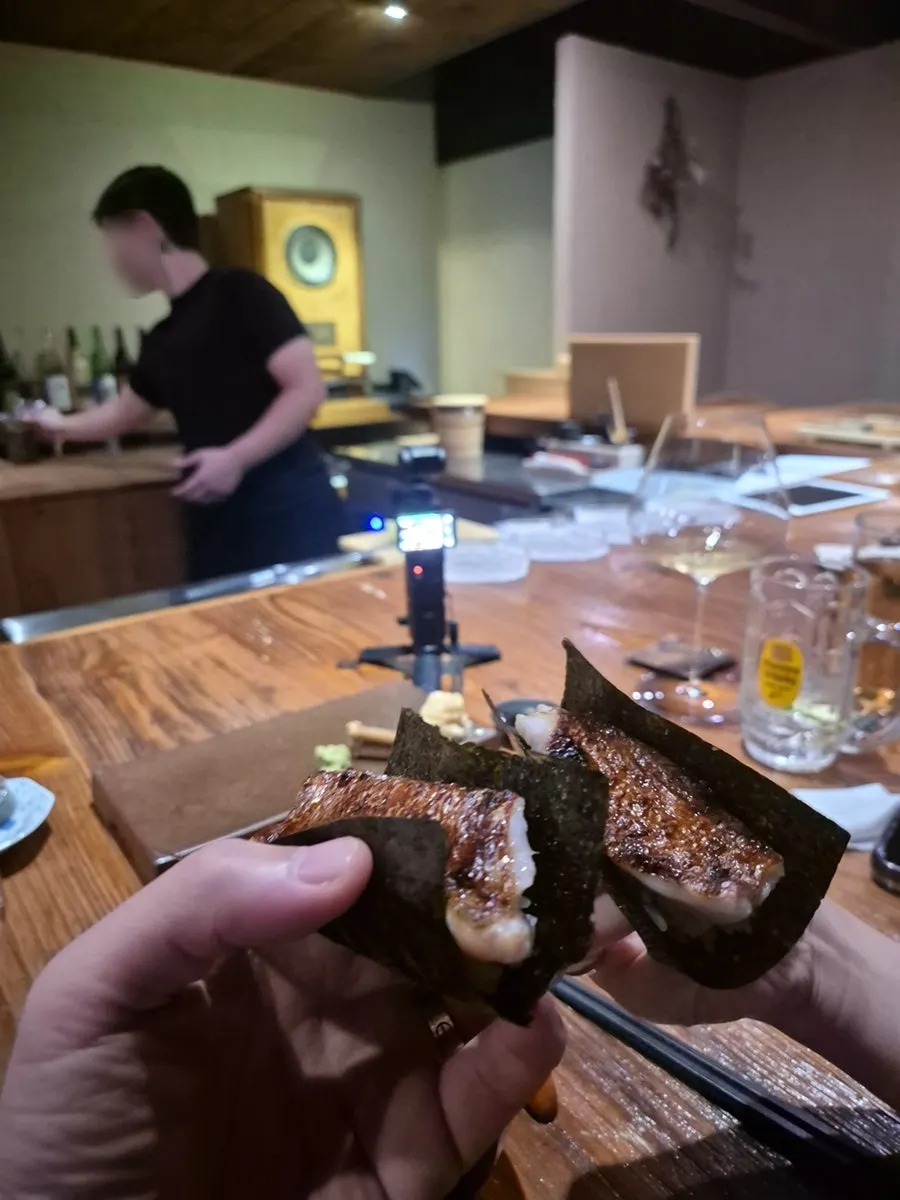 Striped bream sushi served with the skin on