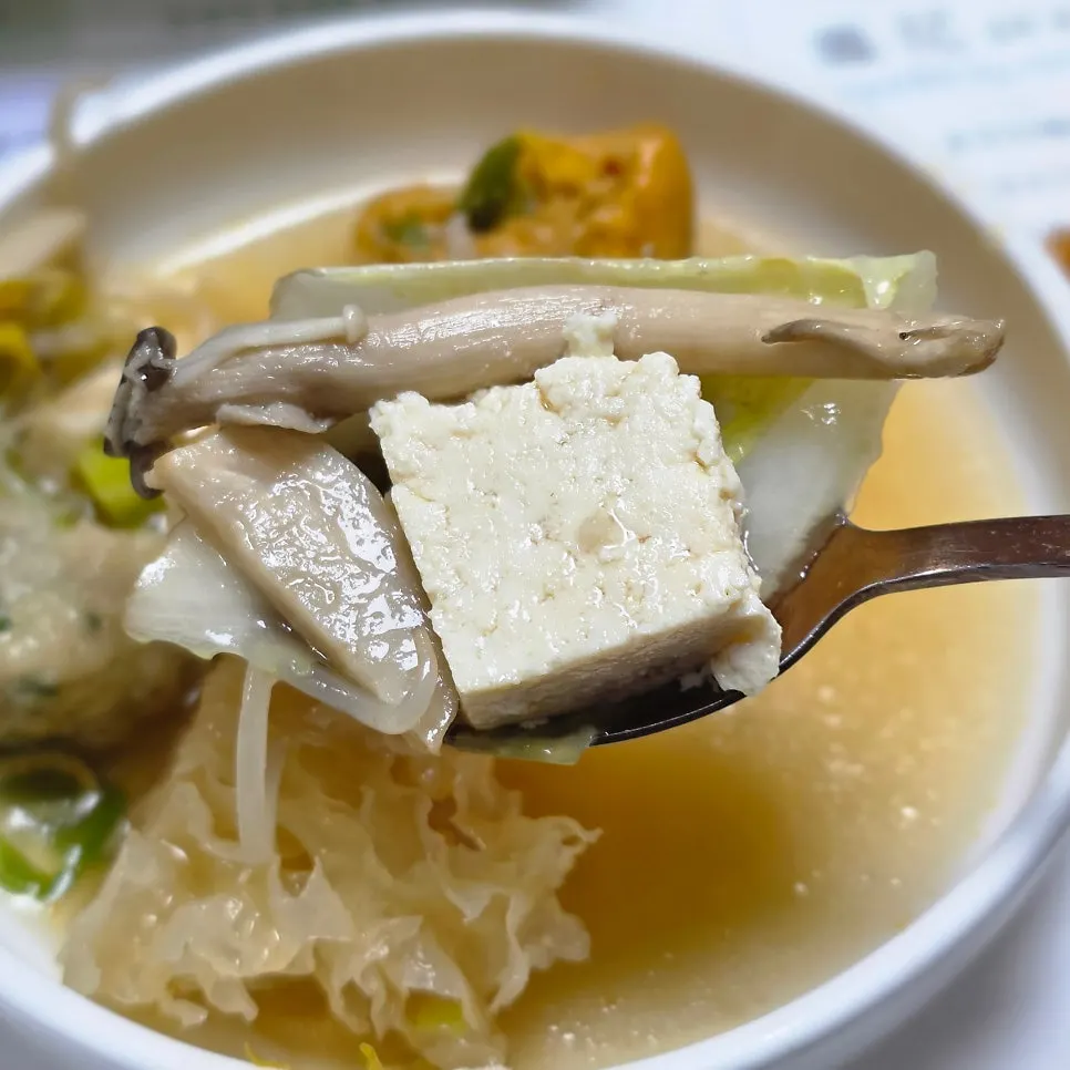 Hand-tofu hot pot scooped into a small bowl