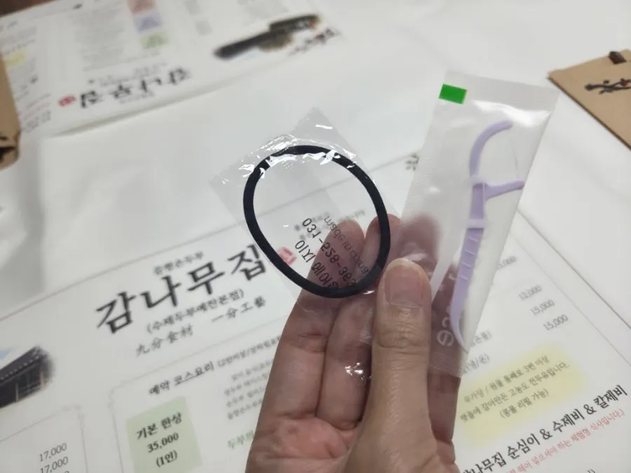 A table set with hair ties and disposable floss