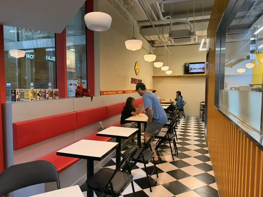 Interior of Zilhal Bros Sangam with red and yellow decor