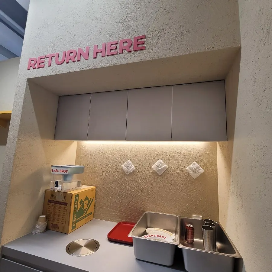 Store TV playing CNN with decor on display