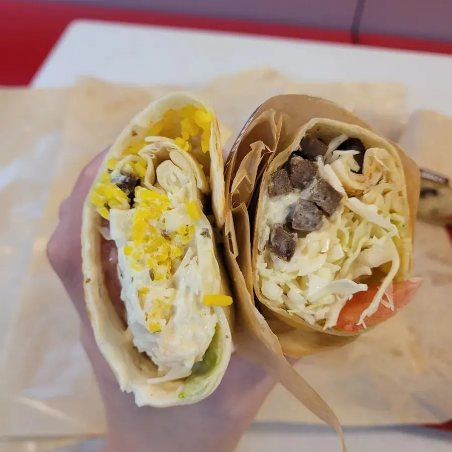 Burrito and kebab served in takeout containers