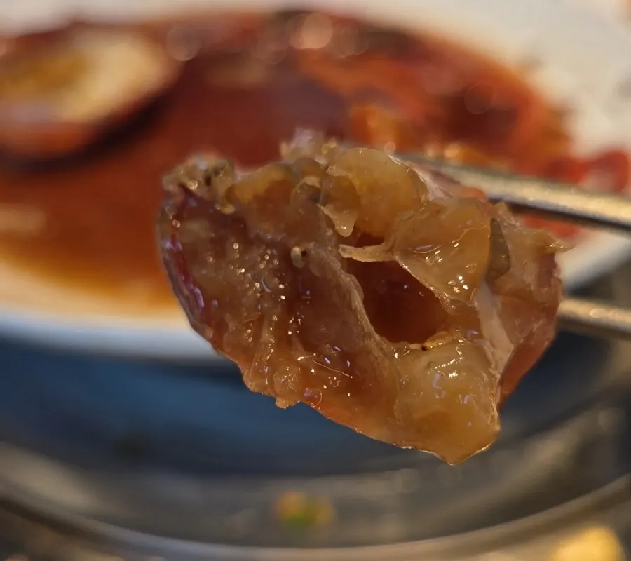 Stone-pot rice eaten with tomalley in the shell
