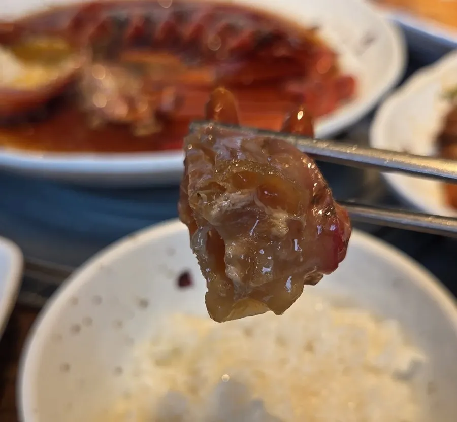 A meal of stone-pot rice mixed with red crab tomalley