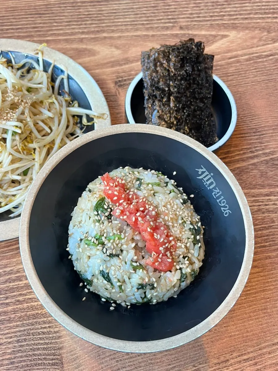 Jin's signature gondre herb rice topped with pollack roe