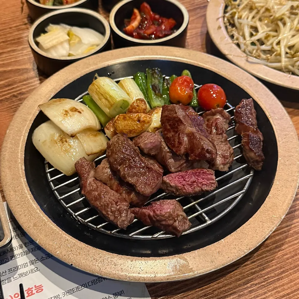 French rack grilling on the pan with an oil splash guard