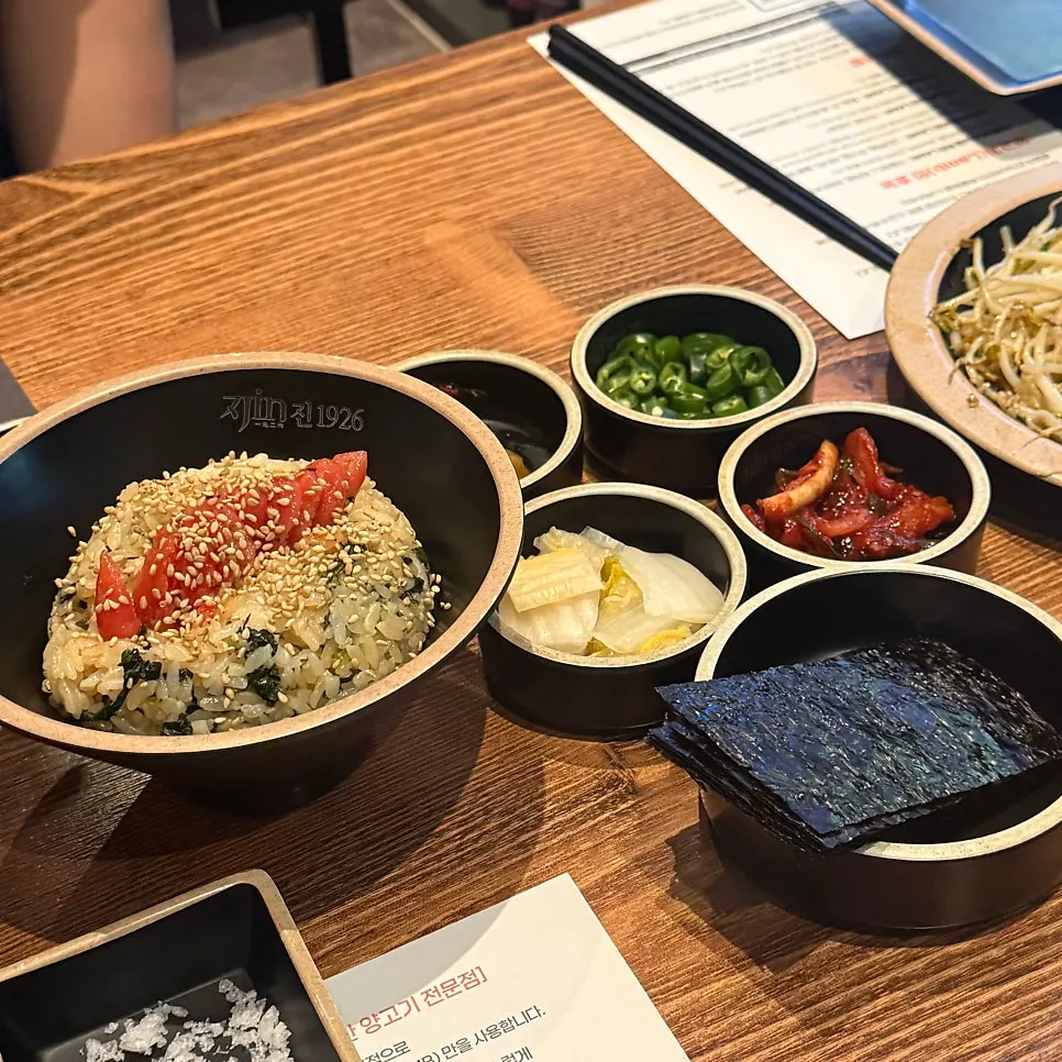 Close-up of gondre rice topped with pollack roe and sesame seeds