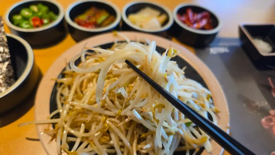Bean sprout side dish served alongside the lamb chops