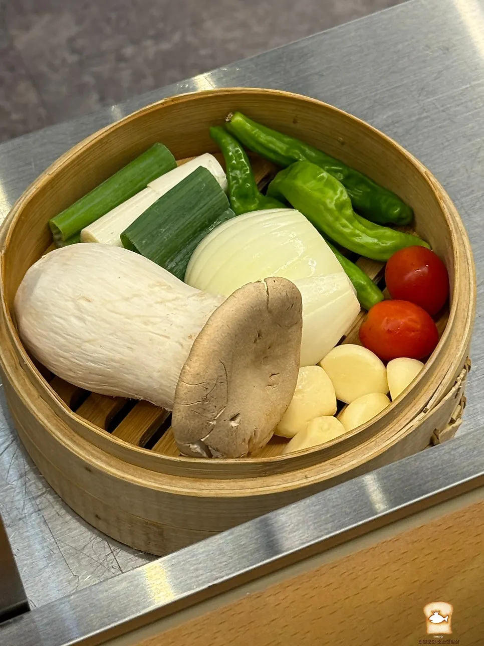 Plate of king oyster mushroom, shishito pepper, and garlic garnish