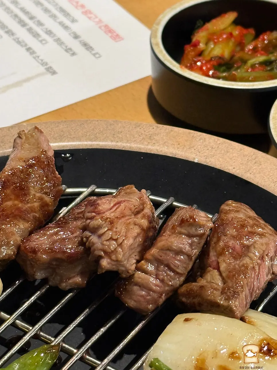 Grilled French rack portioned onto a small plate