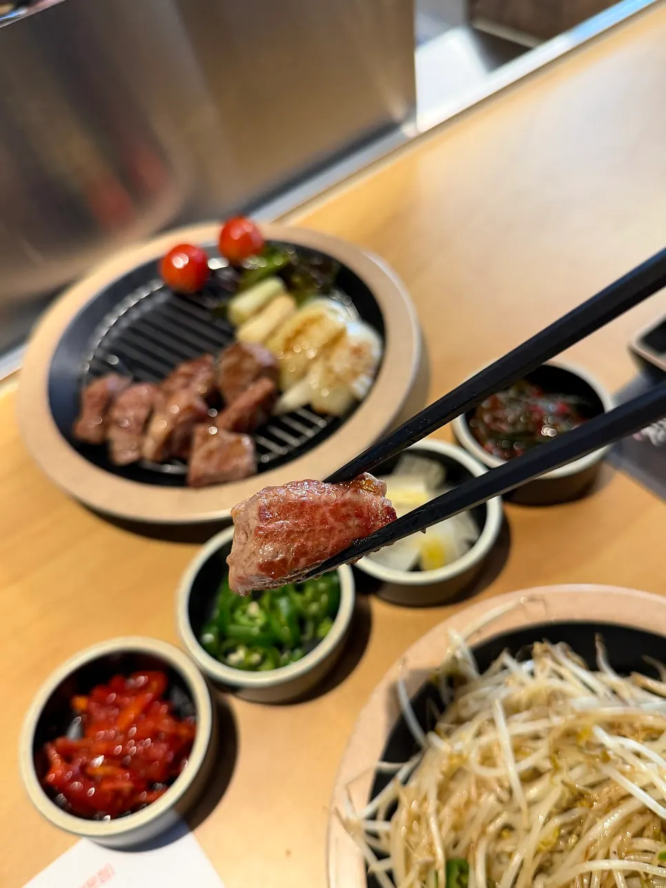 Picking up a piece of grilled lamb ribs
