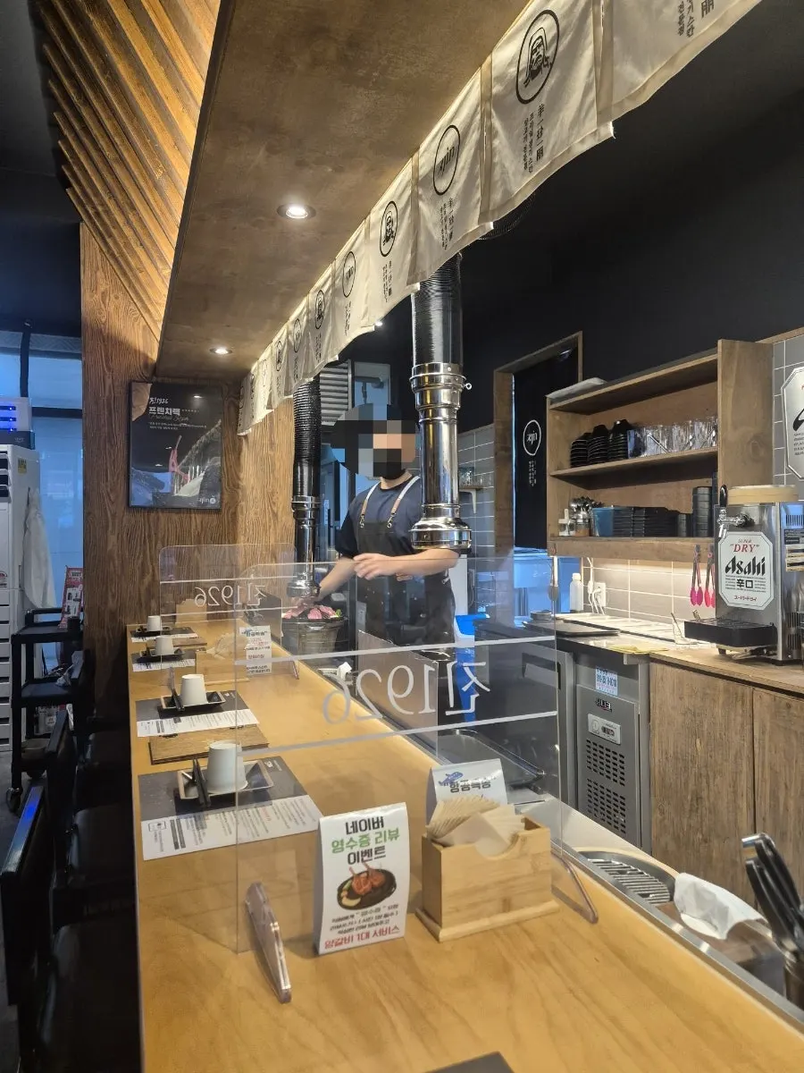 Bar seats with individual grills at Jin 1926 Dasan Branch