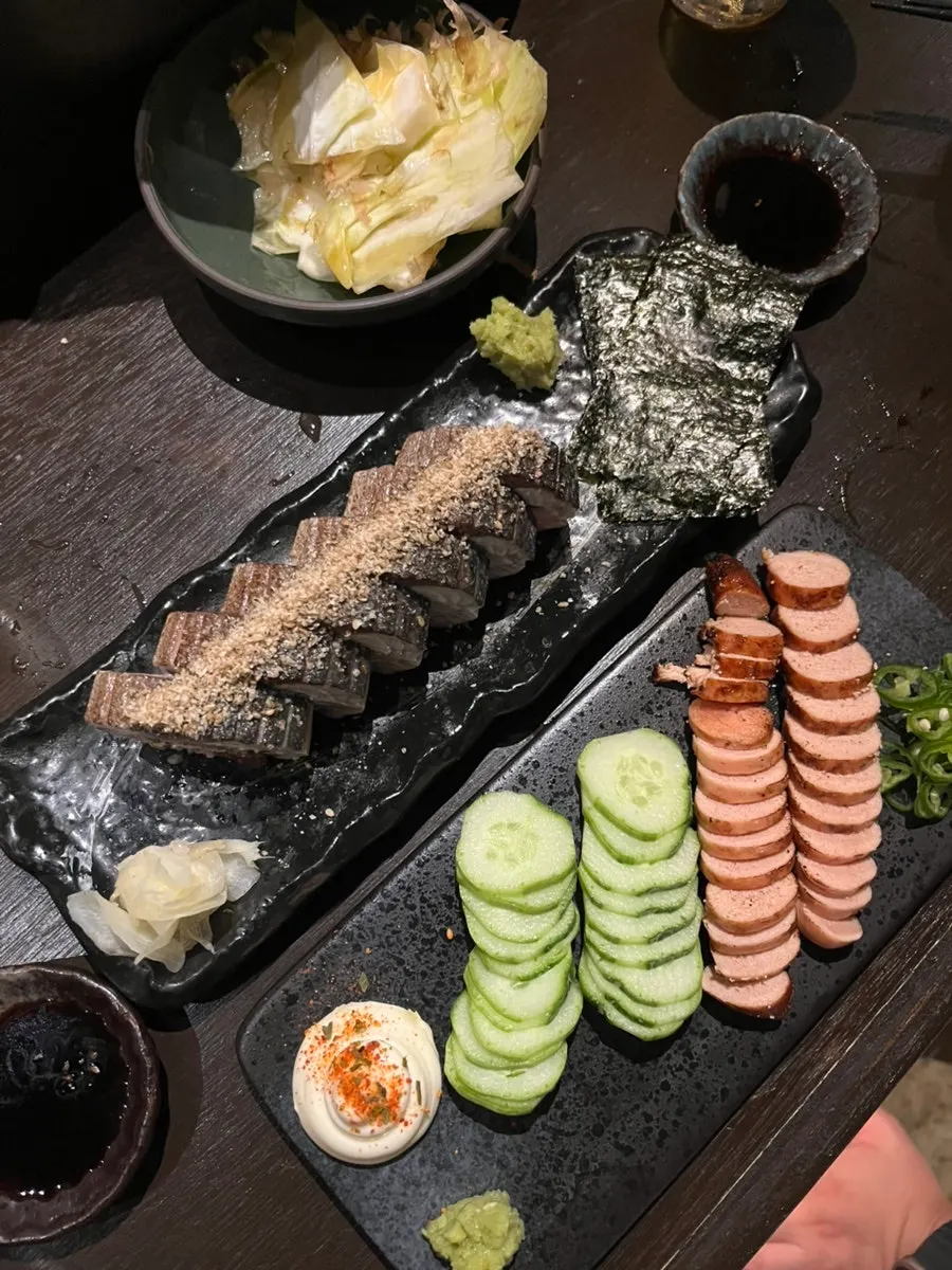 Charcoal-grilled pollock roe served with cucumber and sliced ginger