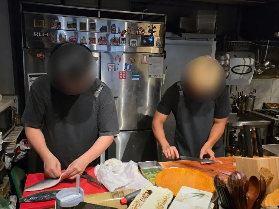 View of the kitchen from the counter seats