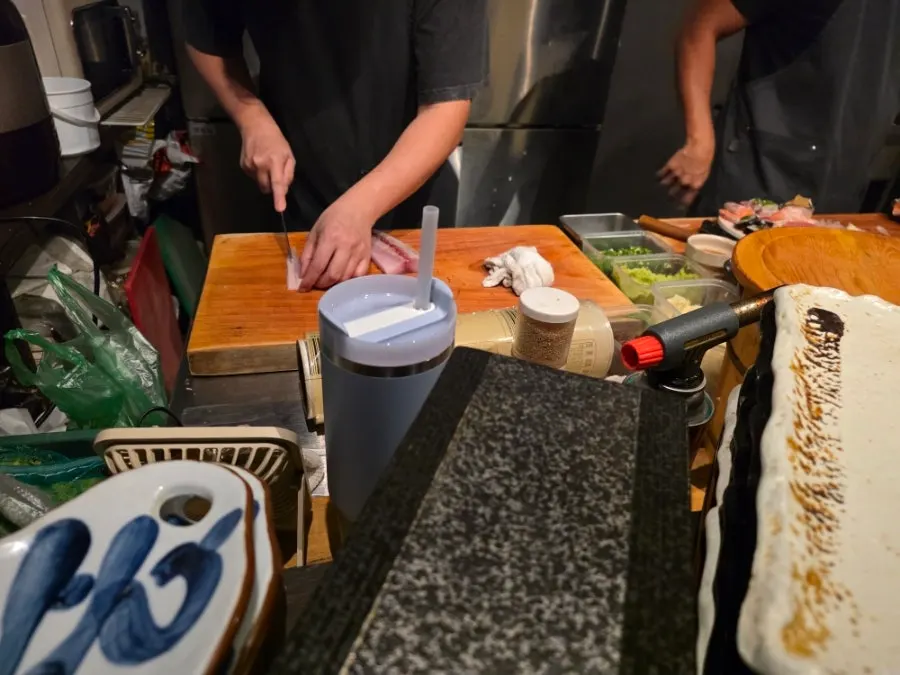 Kitchen in front of the counter seats, preparing food
