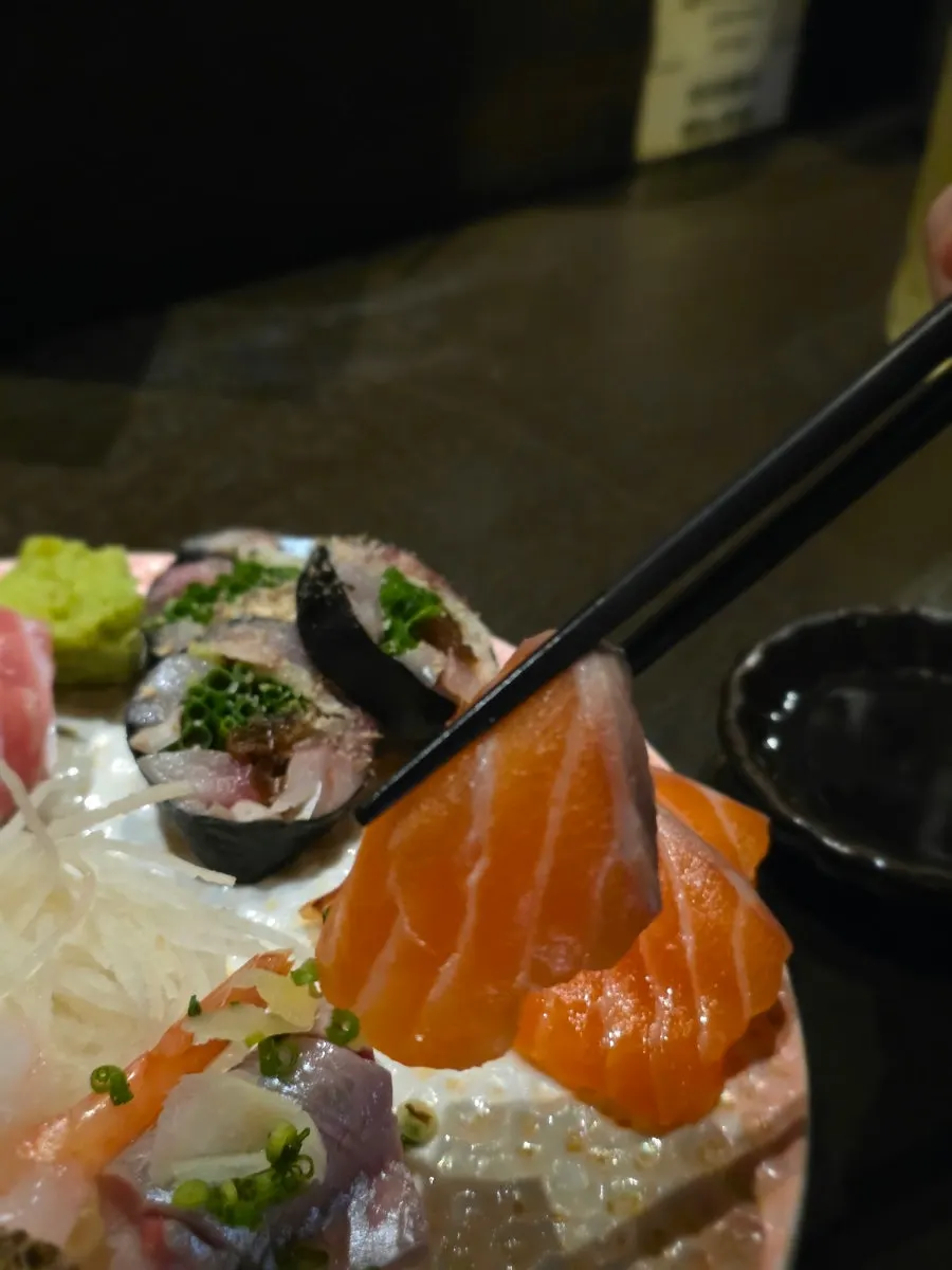 Red seabream sashimi taken as the first bite