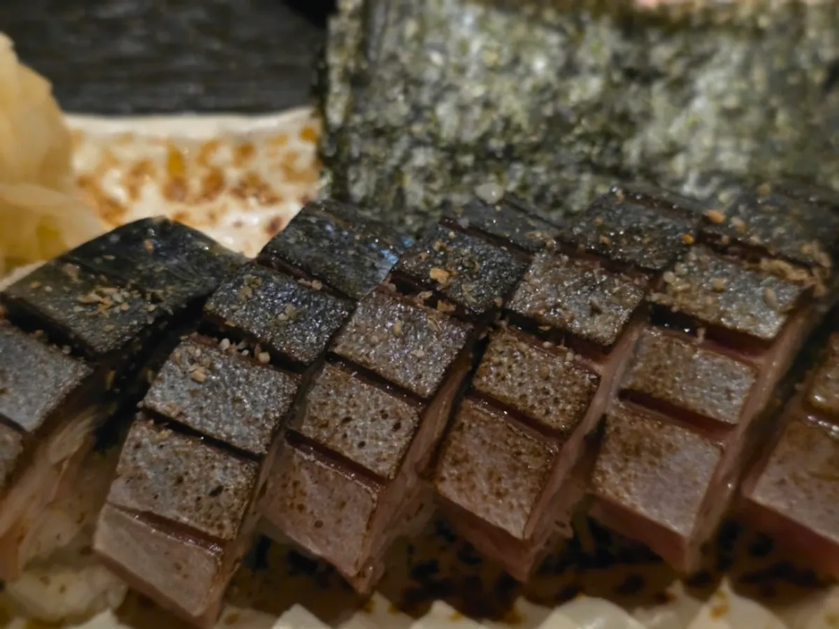 Close-up visual of the mackerel pressed sushi