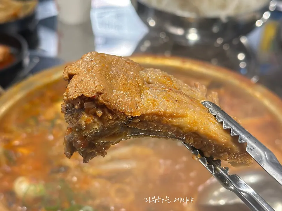 Spicy braised pork ribs with sundubu and egg custard sides at Jin Galmaegal Pungmu Branch