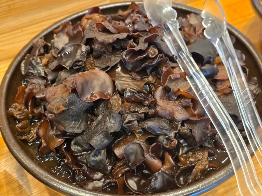 Pickled wood ear mushrooms and pickled mountain garlic at the self-serve corner