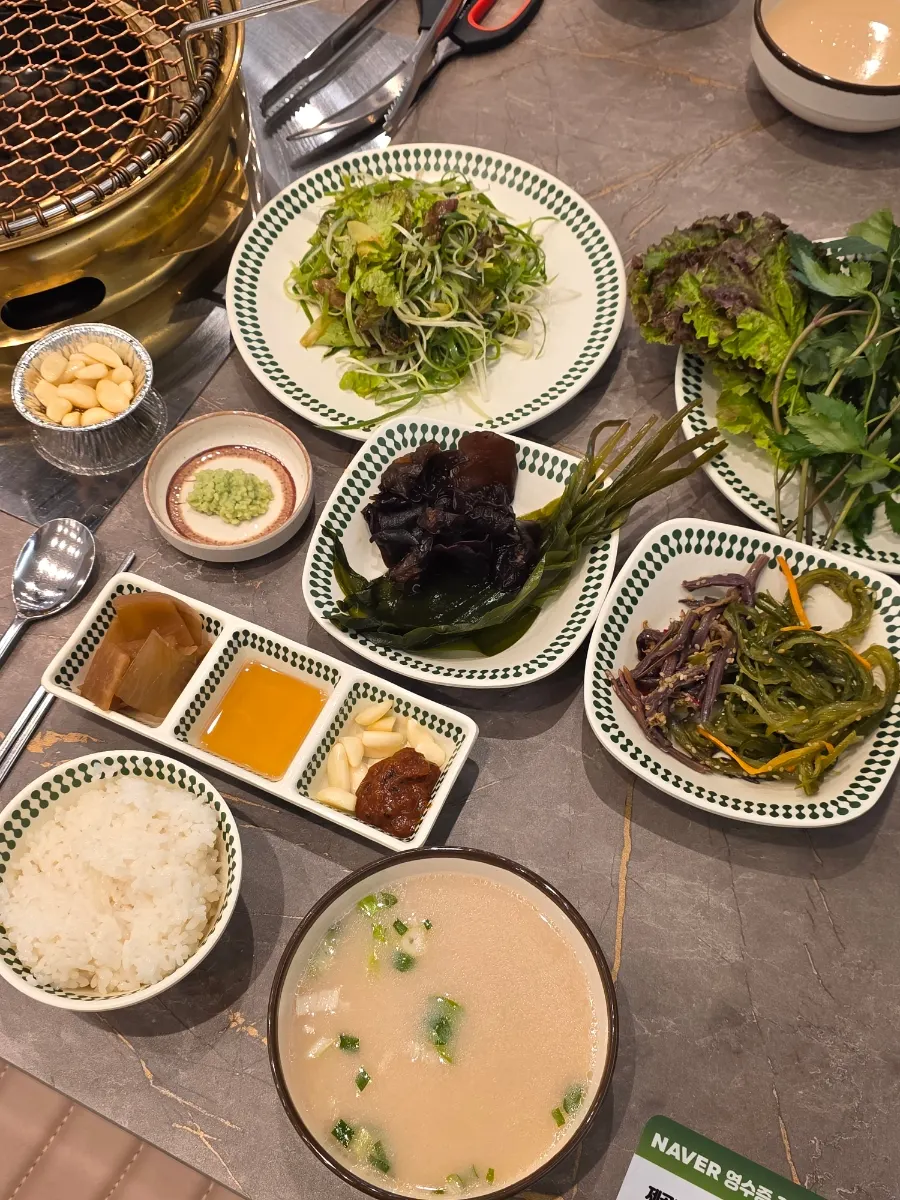 A table filled with food from the self-serve corner