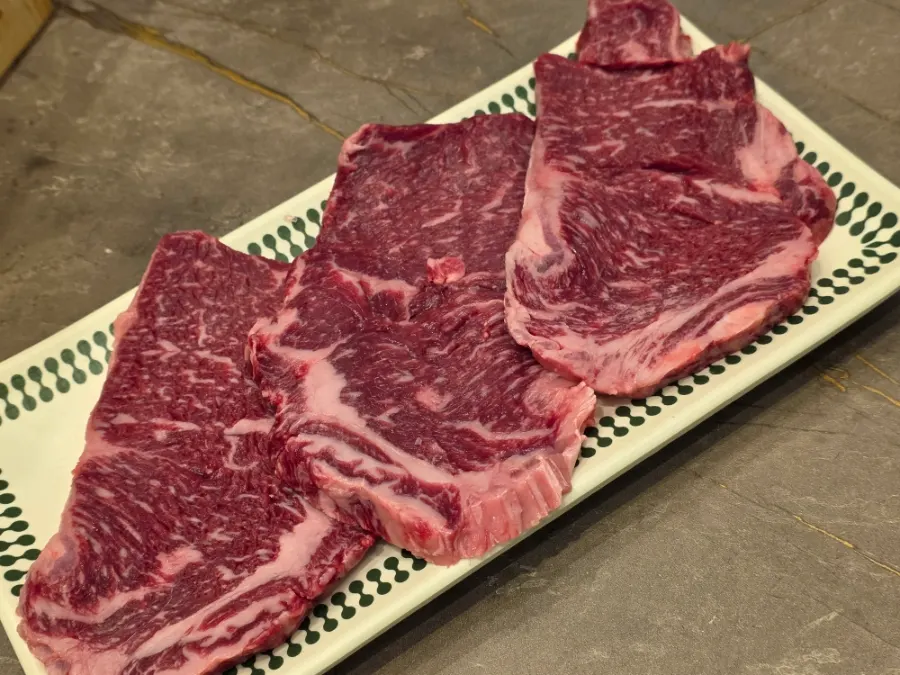 Raw flower marbled ribeye with even marbling