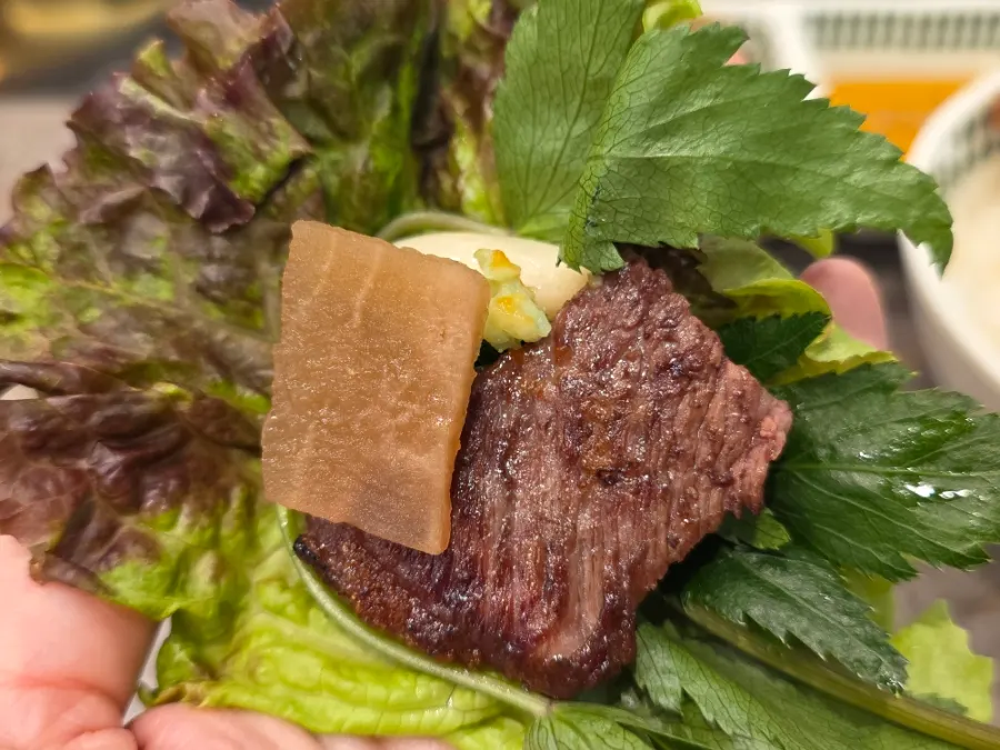 A bowl of bone broth soup eaten alongside the meat