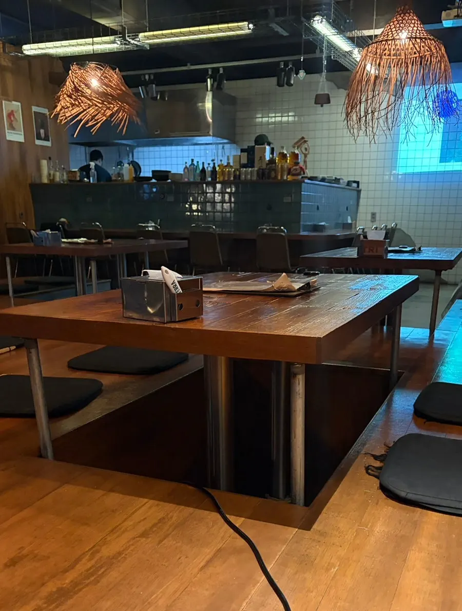 Two-person tables, four-person tables, and bar seating