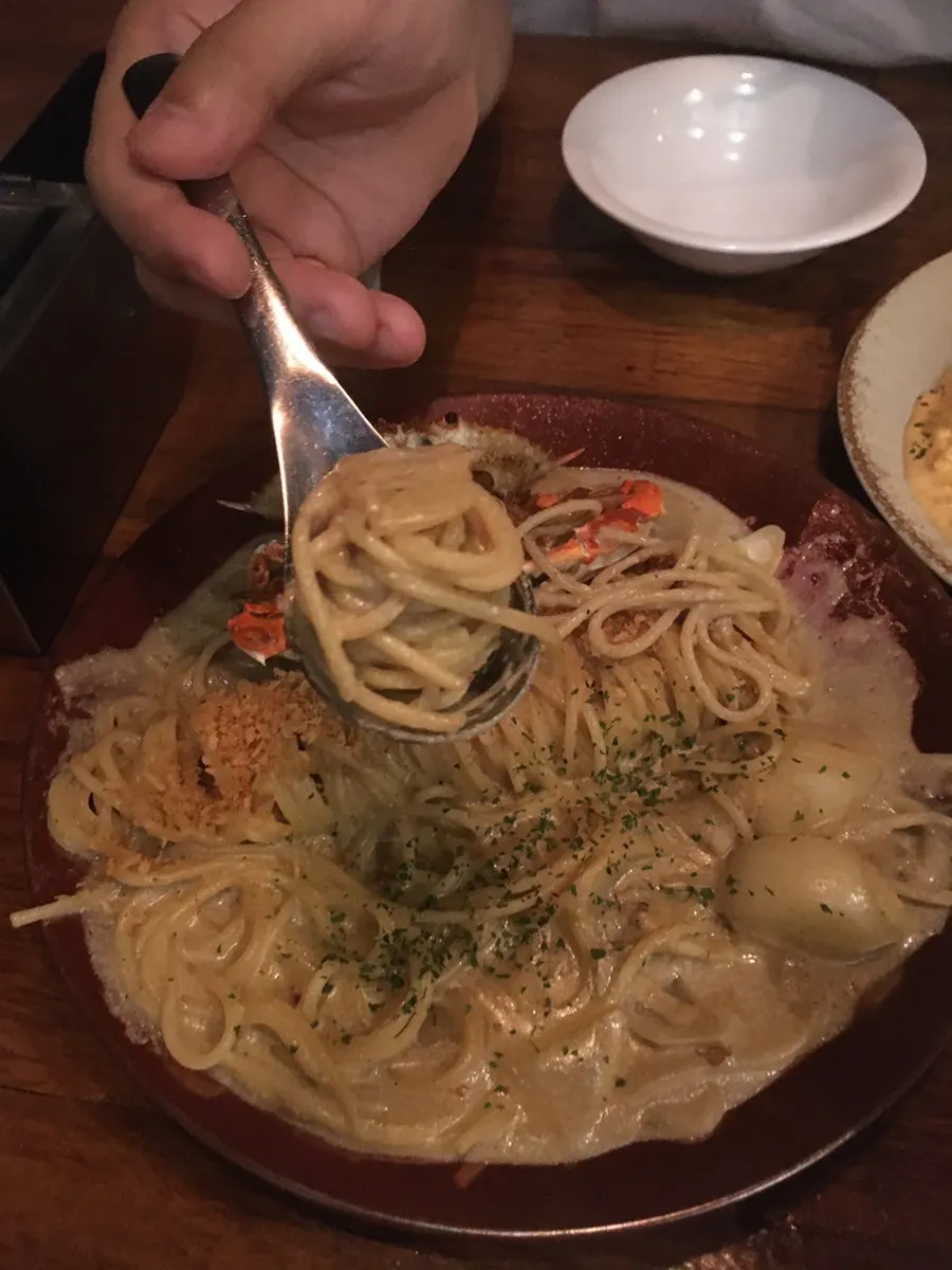 Kani miso pasta topped with crab