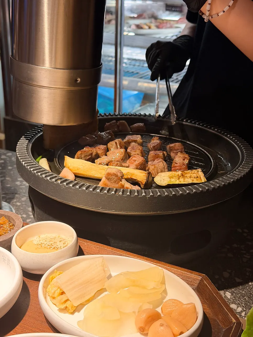 Staff grilling meat on the grill pan