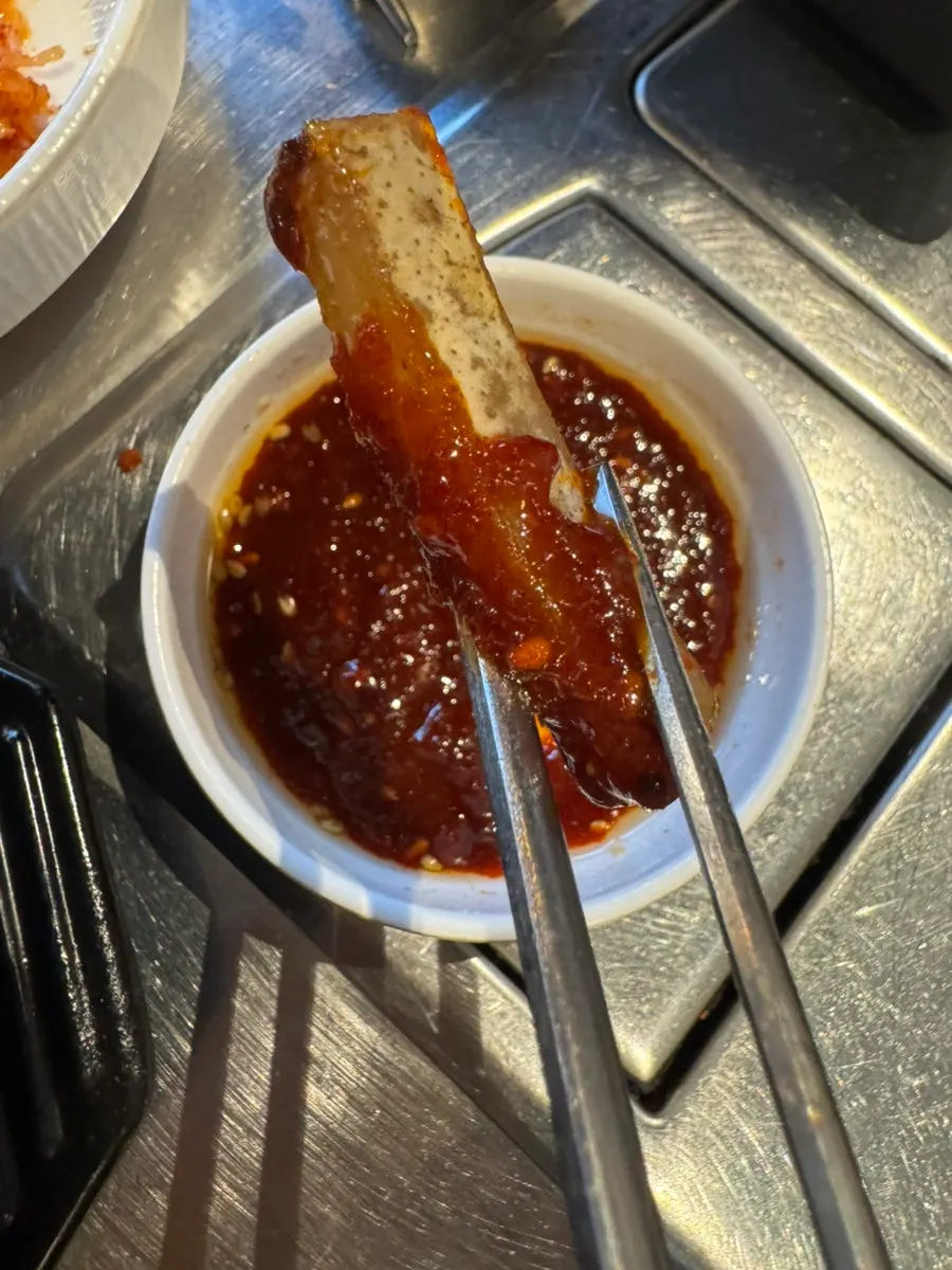 Grilled meat eaten with different sauces