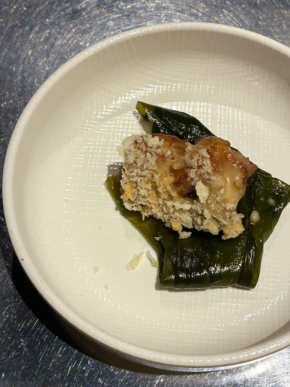 A piece of pork belly dipped in garlic salt