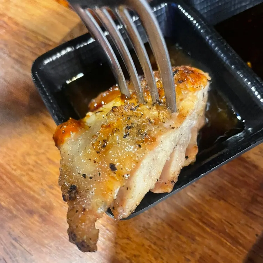 Shashlik meat dipped in chili sauce