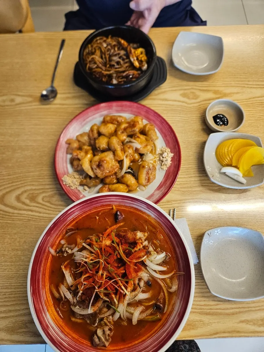 Ttukbaegi samseon ganjjajang topped with a fried egg