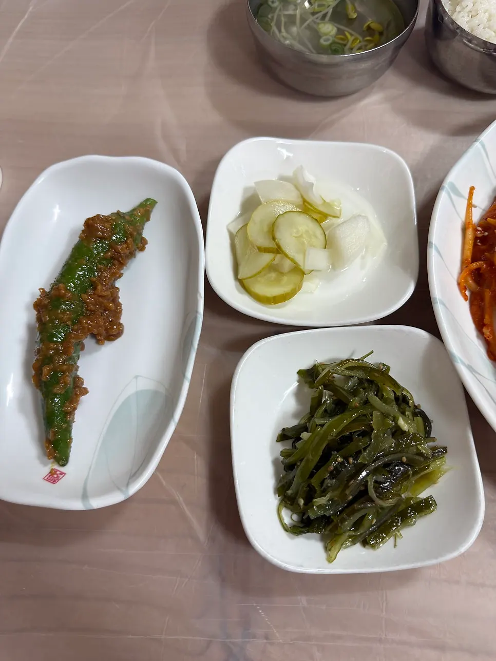 Banchan table setting served alongside agujjim