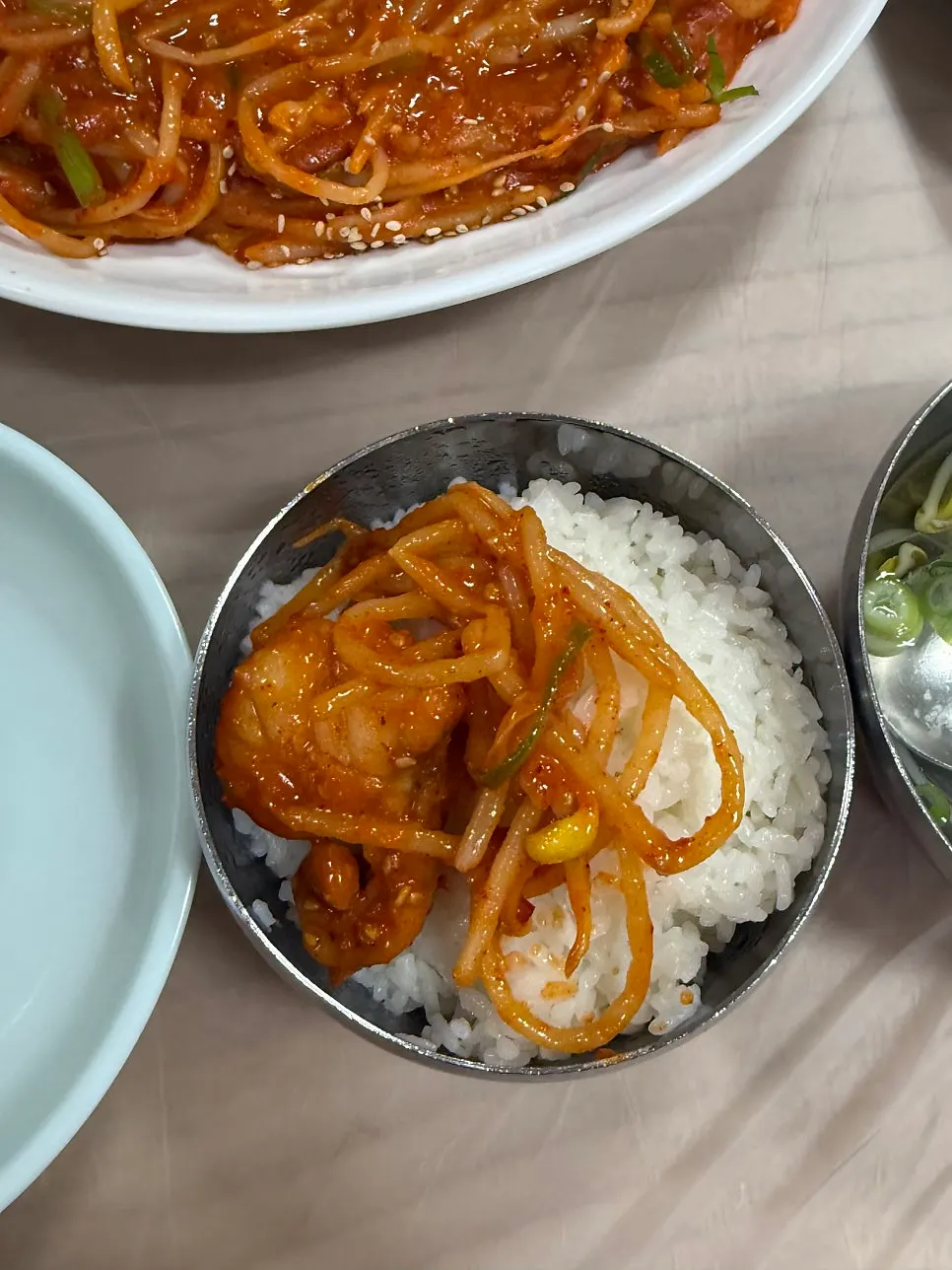 A bite of agujjim placed on top of rice