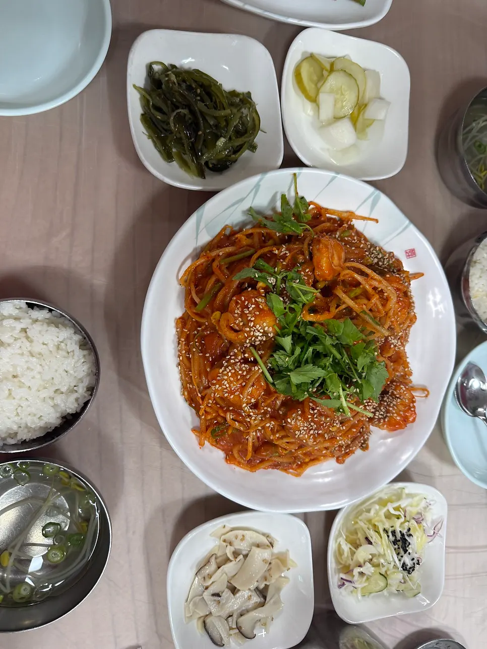 Full spread of small agujjim and rice bowls