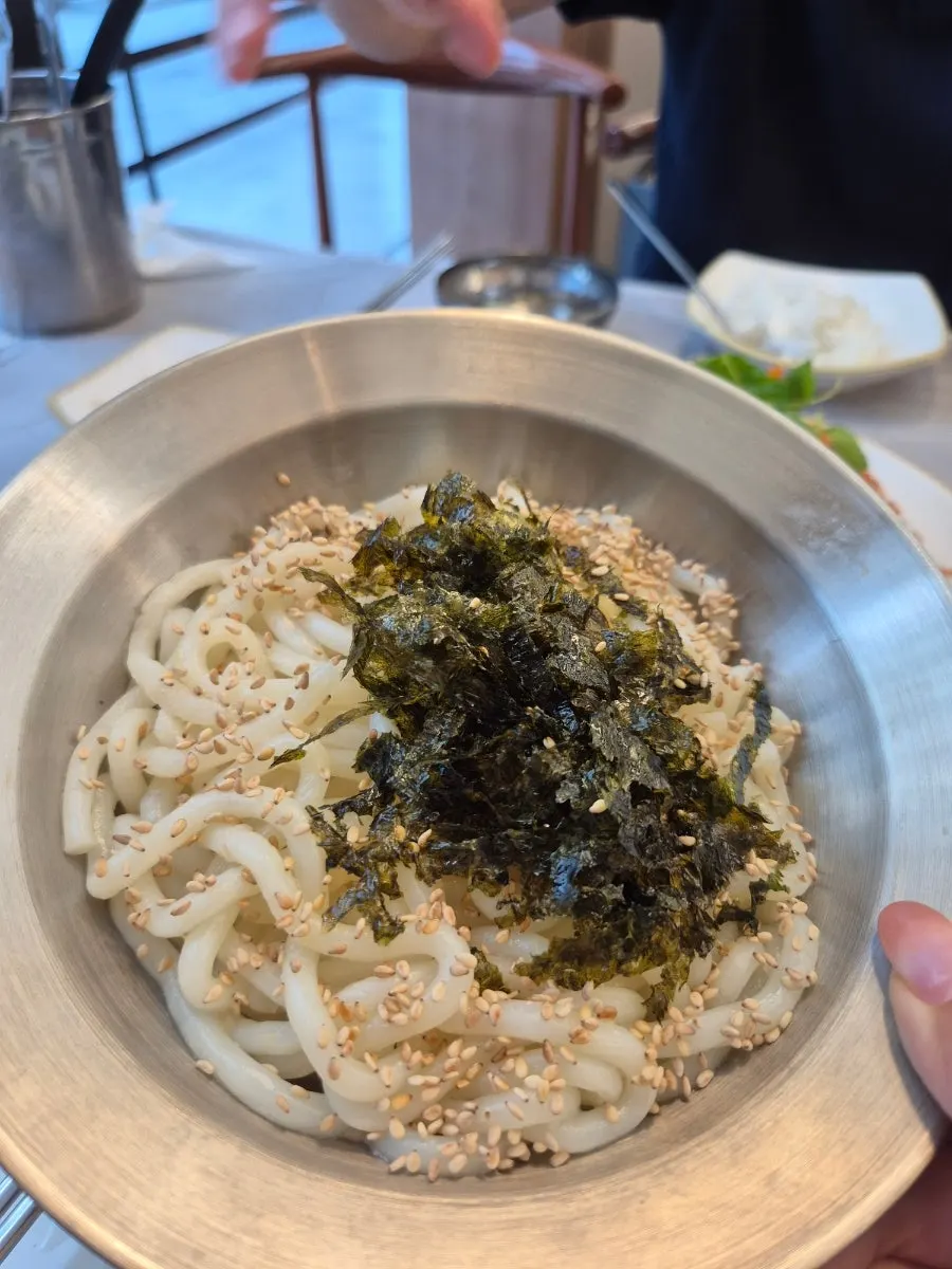 Udon noodles tossed in monkfish stew sauce
