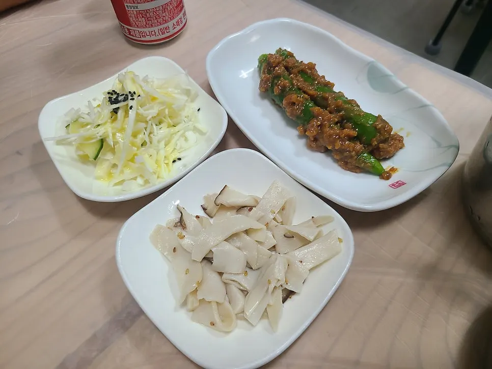 A full spread of side dishes at Jjimgoeul