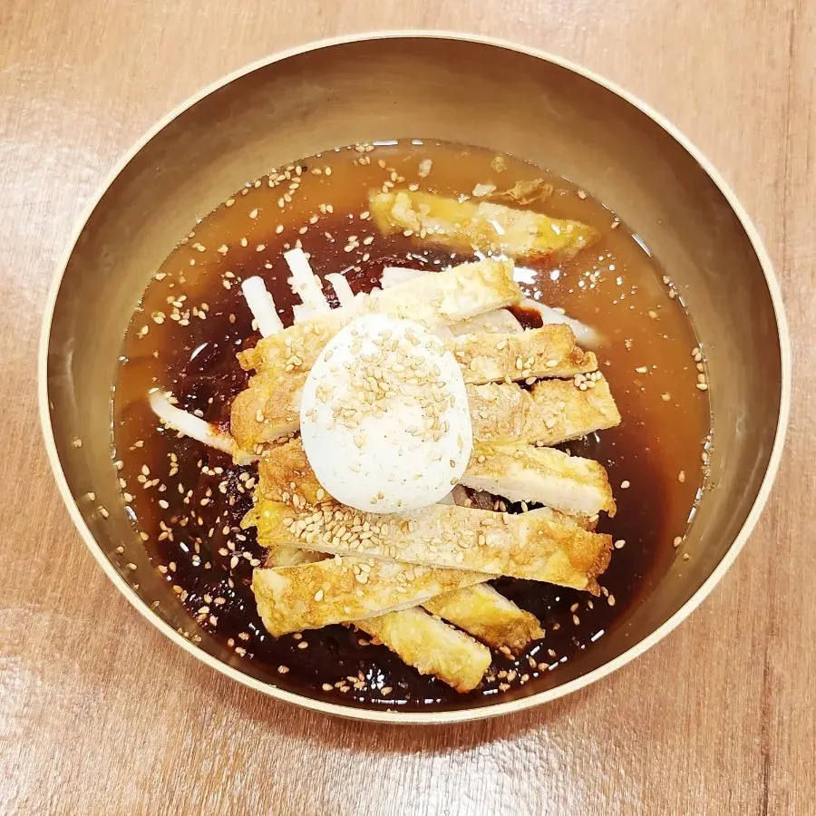 Table with naengmyeon and yukjeon