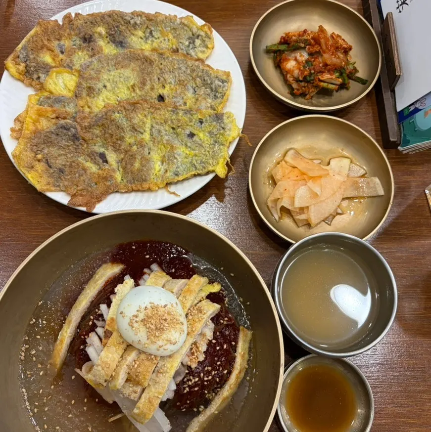 Mixed naengmyeon topped with pork yukjeon