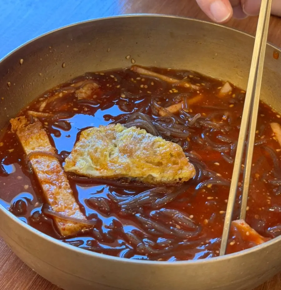 A bite combining naengmyeon and yukjeon