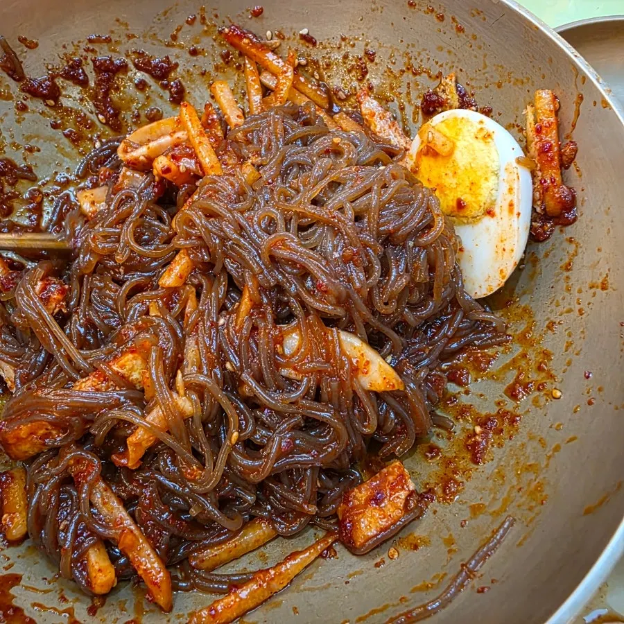Bibim naengmyeon mixed with baegeumcho and mustard sauce