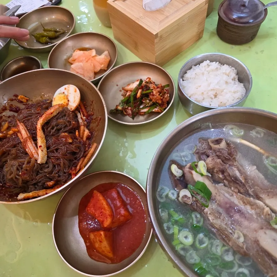 Noodles from Jinju bibim naengmyeon lifted with chopsticks