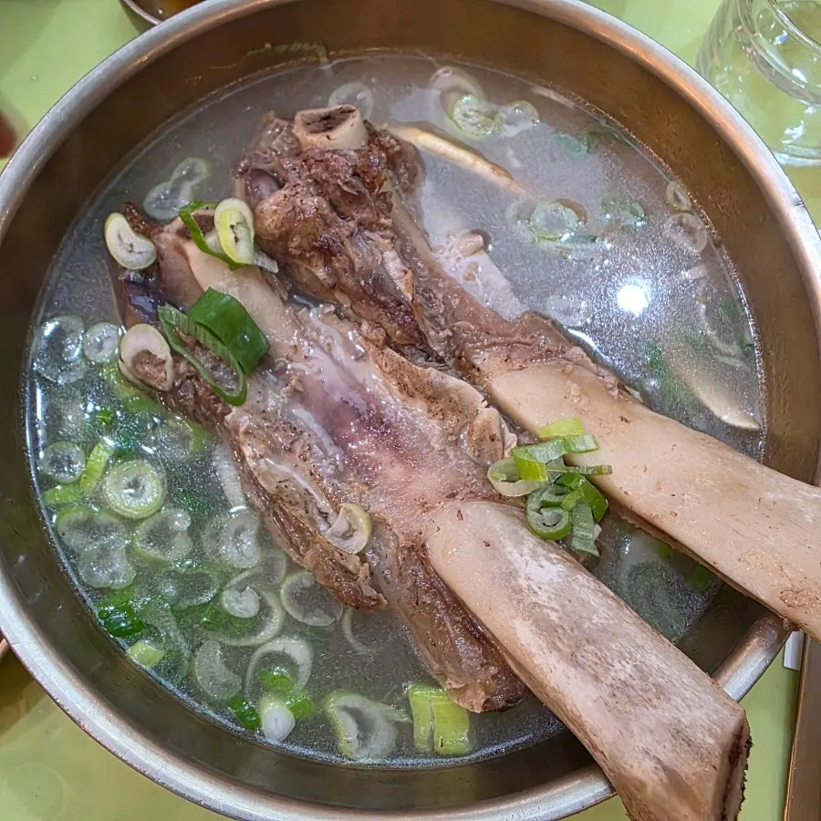Clear galbitang broth with two rib bones